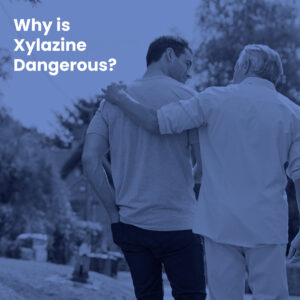 father and adult son walking with quote: "Why is Xylazine Dangerous?"
