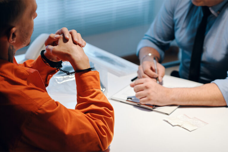 inmate speaking with an investigator