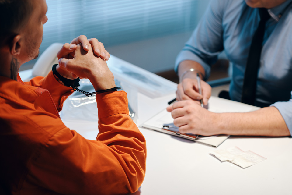 inmate speaking with an investigator