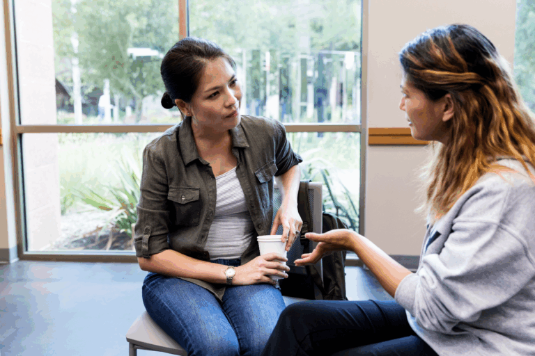 conversation between two women in an open room