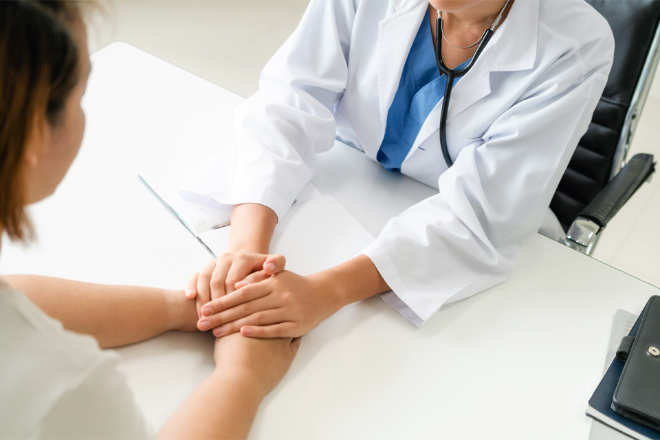 doctor holding patients' hands - Why Many Opioid Treatment Programs (OTPs) Fail Patients and How CMS Can Help